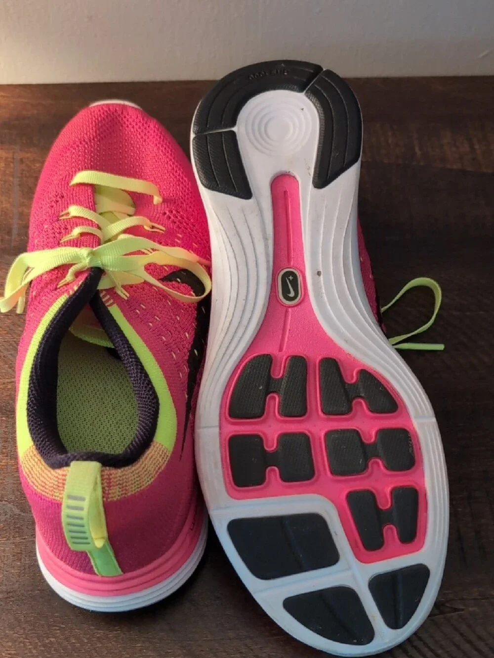 Nike Women’s Pink and Neon Yellow Flyknit Running Shoes